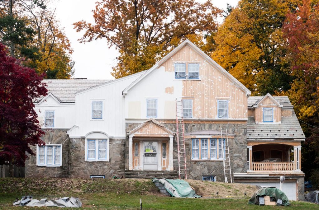 A Grandview Painting expert providing exterior painting in Asbury, IA, showing why we’re trusted for detail-oriented and reliable paint services. Exterior Painting near me.