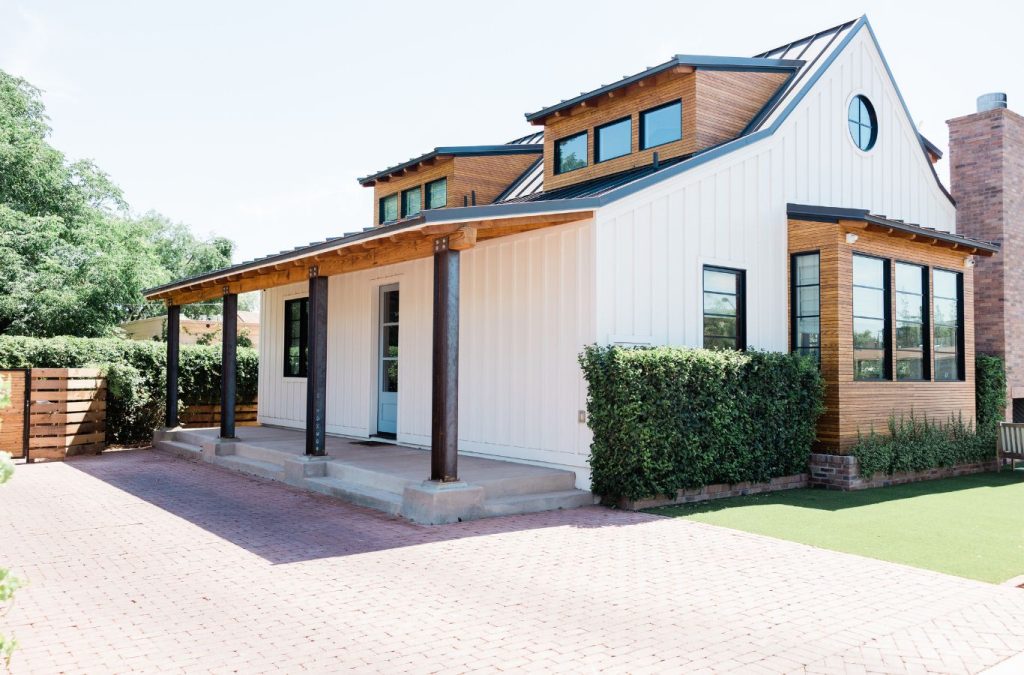 A Grandview Painting specialist delivering exterior painting in Platteville, WI, showcasing the advantages of hiring a local, reliable expert for your painting needs.
