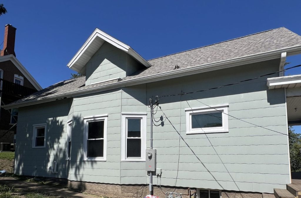 A Grandview Painting professional expertly performing exterior painting in Cuba City, WI, using high-quality tools for exceptional results.
