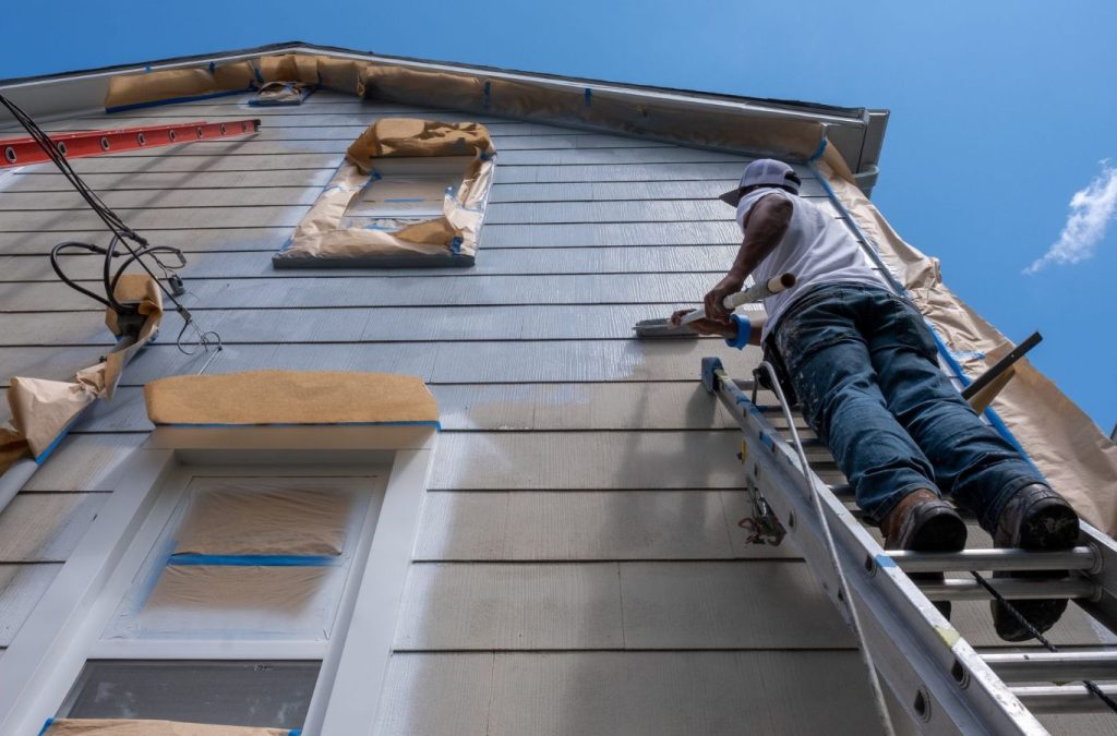 A Grandview Painting expert in Cuba City, WI, applying a flawless exterior coat, showing why customers choose our service for outstanding results. Exterior Painting near me.