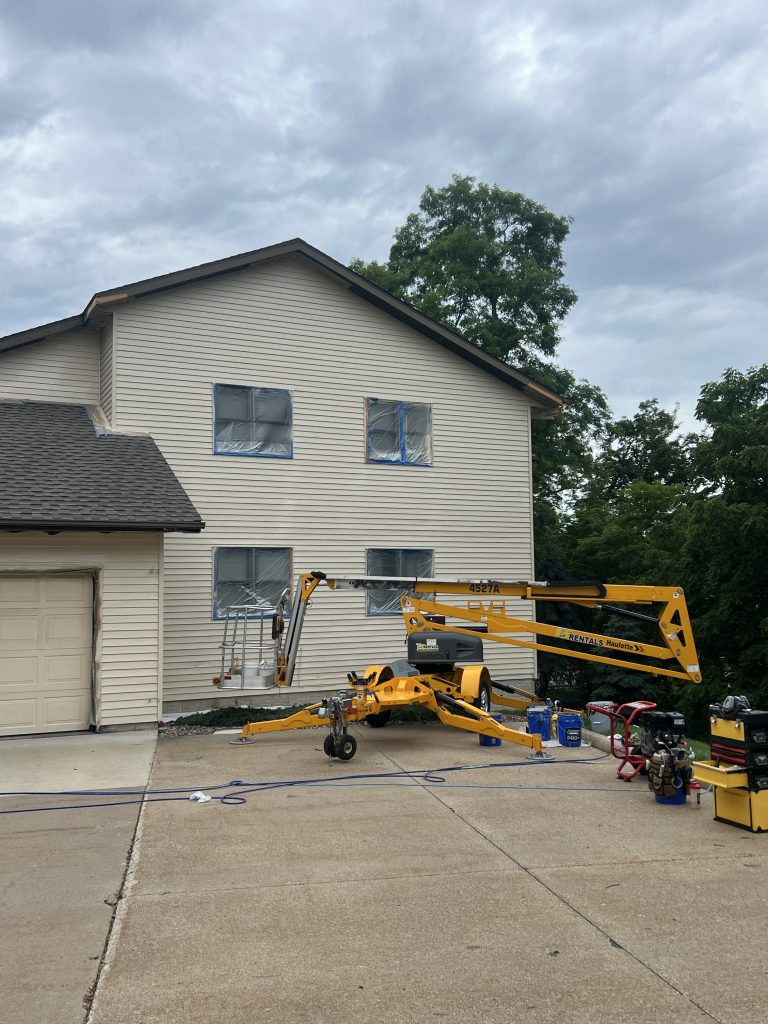 Grandview Painting expert completing exterior painting in Manchester, IA ensuring weather protection and long-lasting finish. Exterior Painting Near Me.